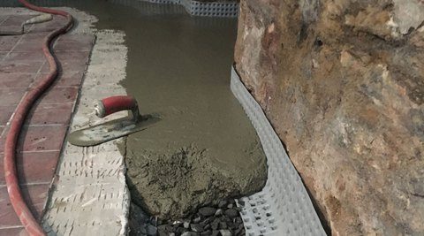 Basement floor waterproofing with wet cement